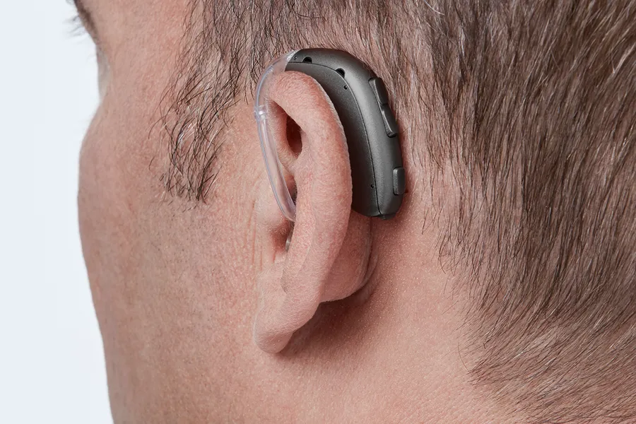 Oticon Xceed BTE SP C092SteelGrey AngleB45 Close up In On Ear MS 6930 Man 1200x800px Original file