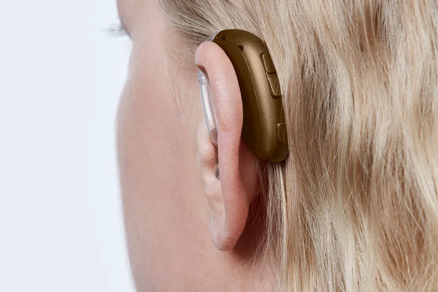 Oticon Xceed BTE SP C093ChestnutBrown AngleB45 Close up In On Ear MS 3531 Woman 1200x800px Original file