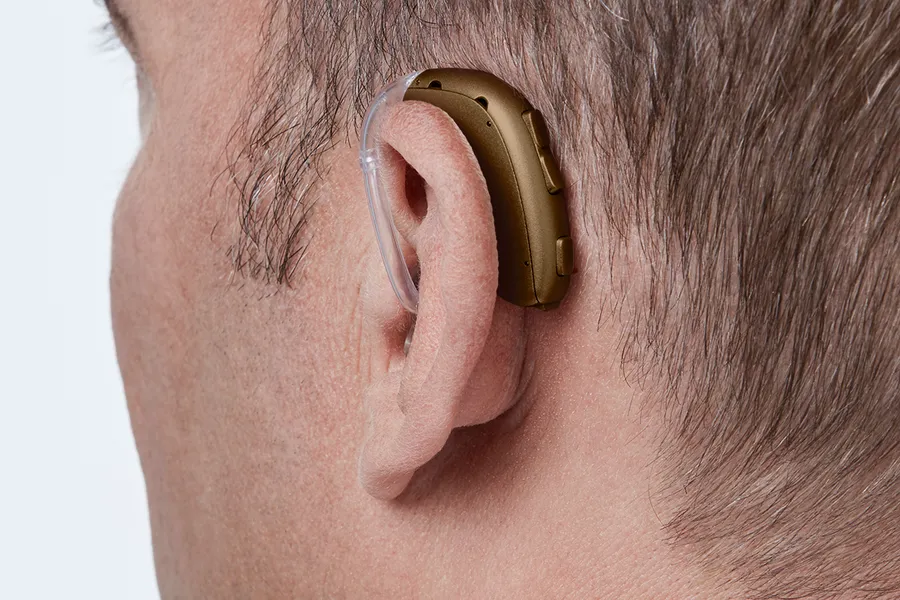 Oticon Xceed BTE SP C093ChestnutBrown AngleB45 Close up In On Ear MS 6930 Man 1200x800px Original file